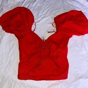 Red top with puffy sleeves